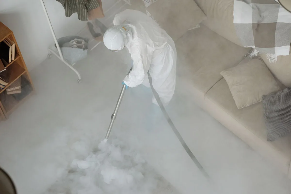Biohazard cleanup technician in protective equipment, North Alamo, TX